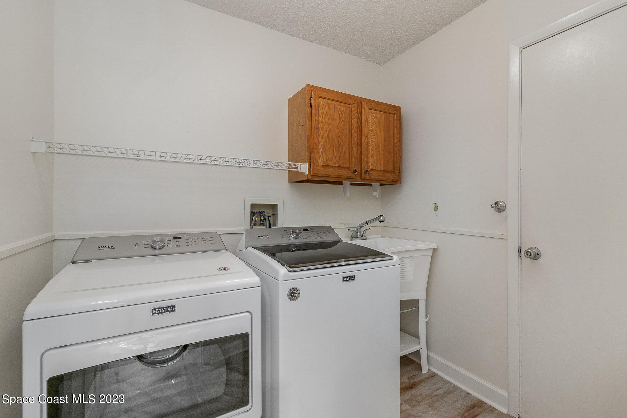 833 Pine Shadows Avenue Rockledge, FL 32955 - Photo 18 of 24 a utility room with dryer and washer