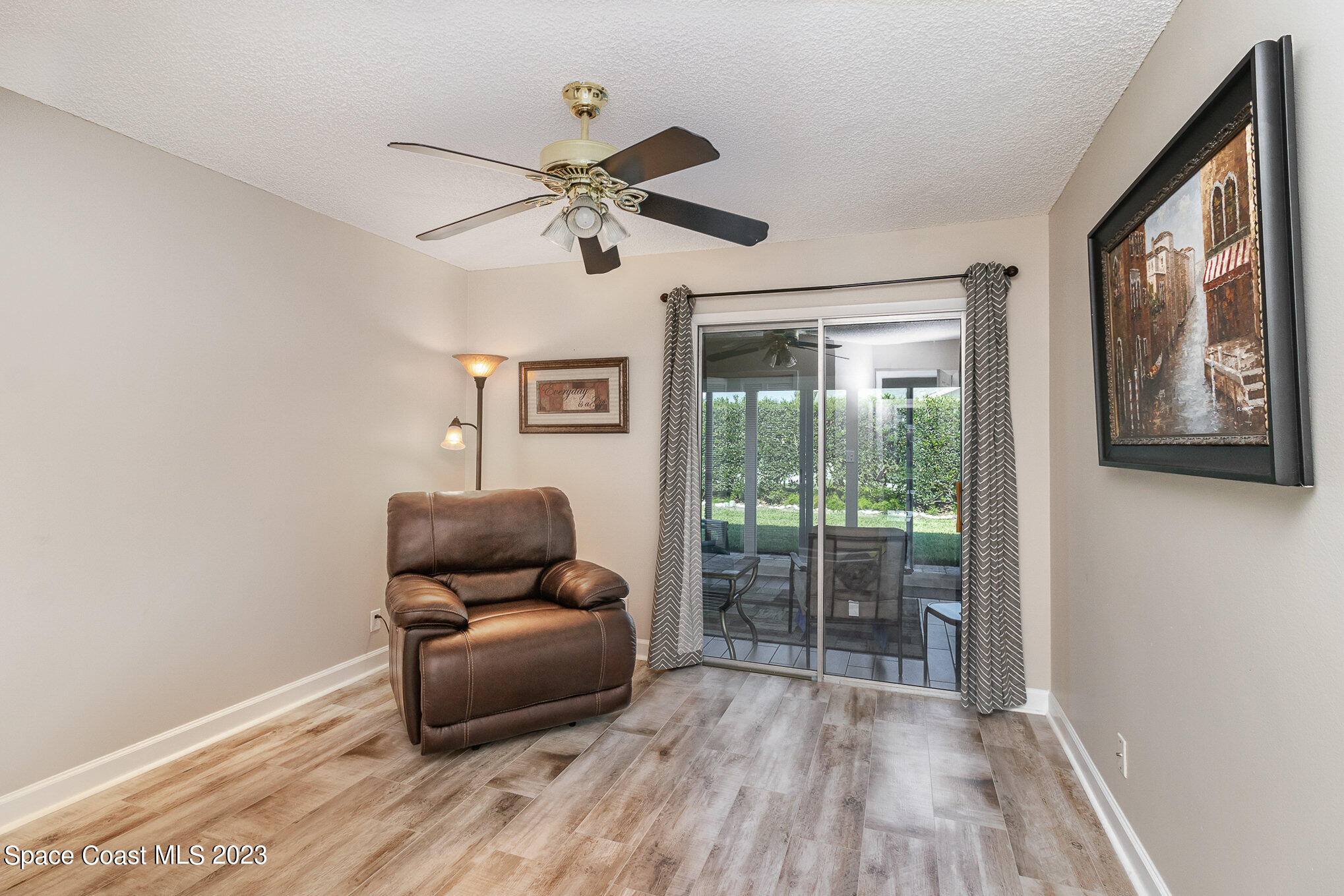 833 Pine Shadows Avenue Rockledge, FL 32955 - Photo 20 of 24 a living room with furniture and a window