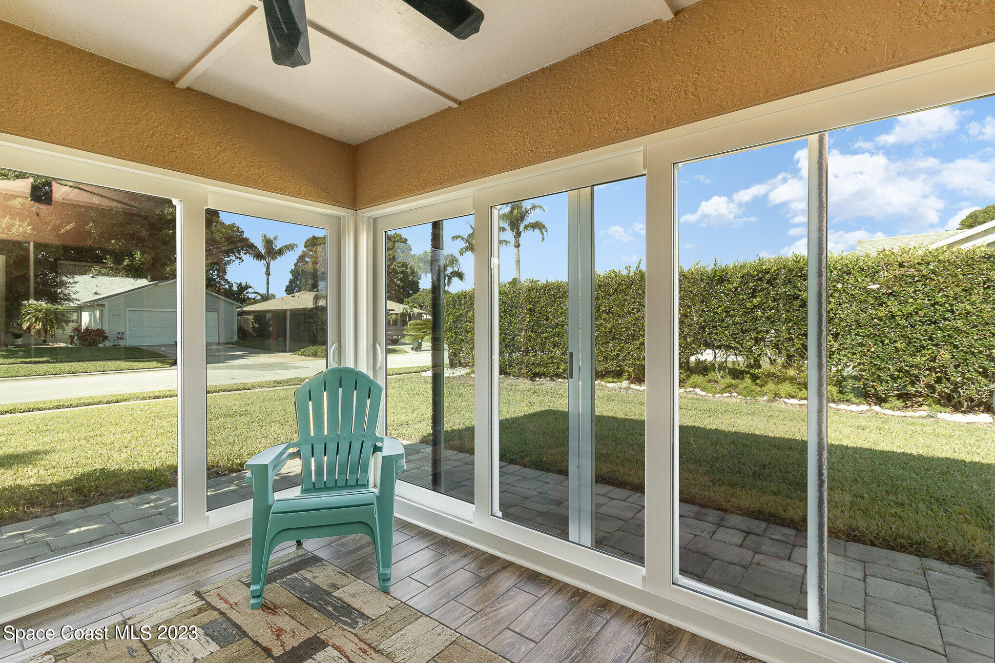 833 Pine Shadows Avenue Rockledge, FL 32955 - Photo 22 of 24 a view of porch with a furniture and floor to ceiling window