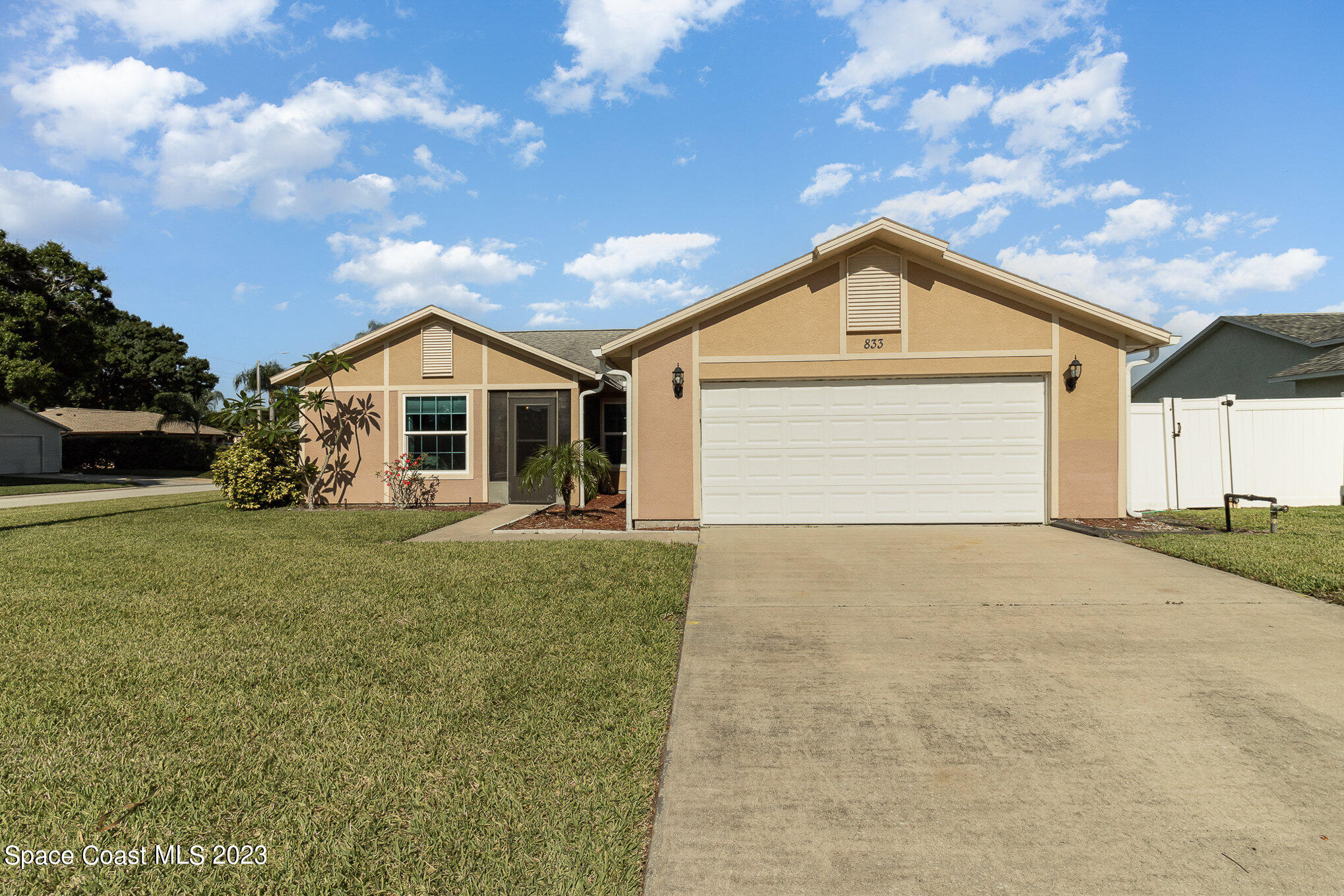 833 Pine Shadows Avenue Rockledge, FL 32955 - Photo 3 of 24 a front view of a house with garden