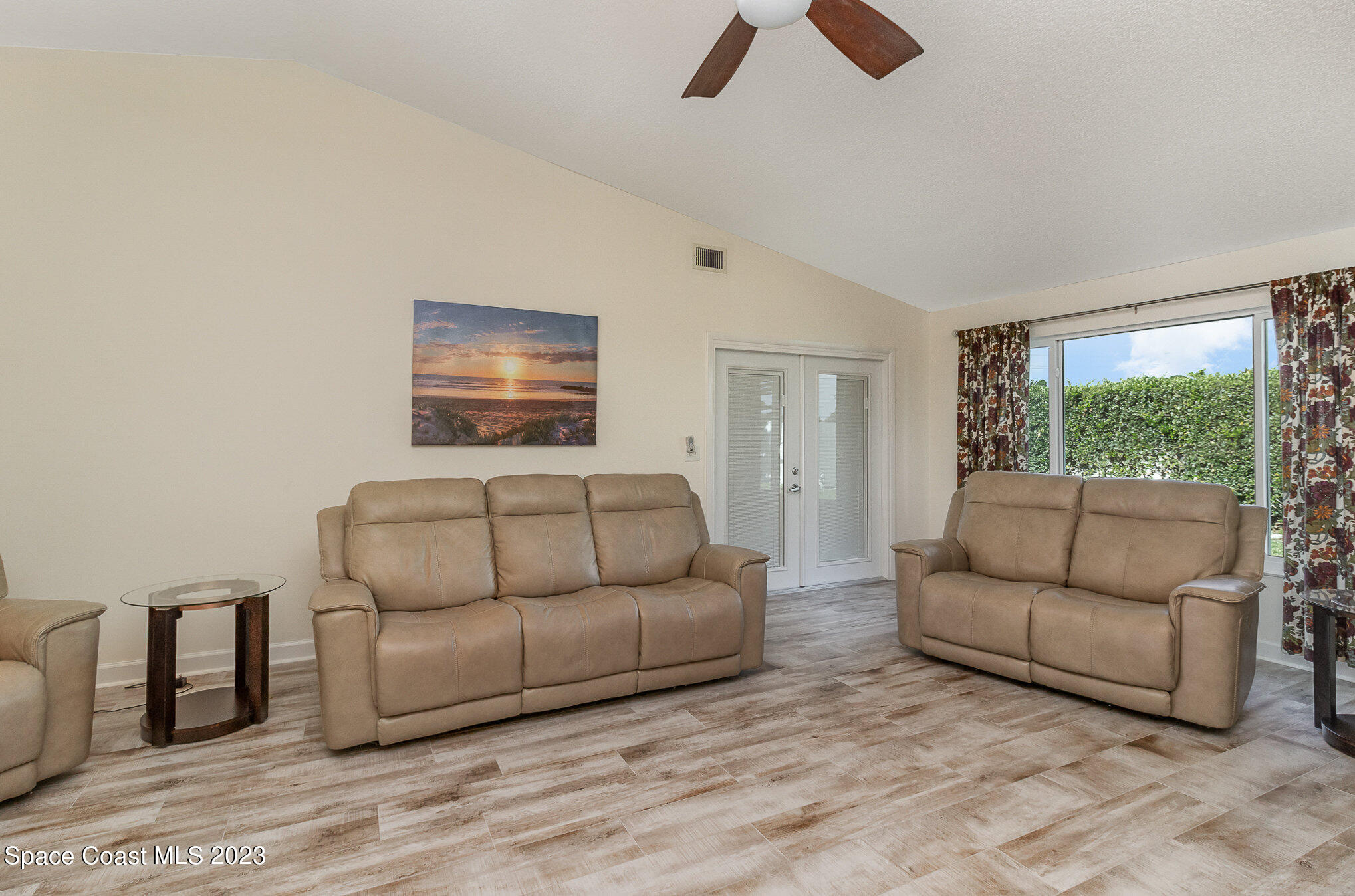 833 Pine Shadows Avenue Rockledge, FL 32955 - Photo 4 of 24 a living room with furniture and a large window