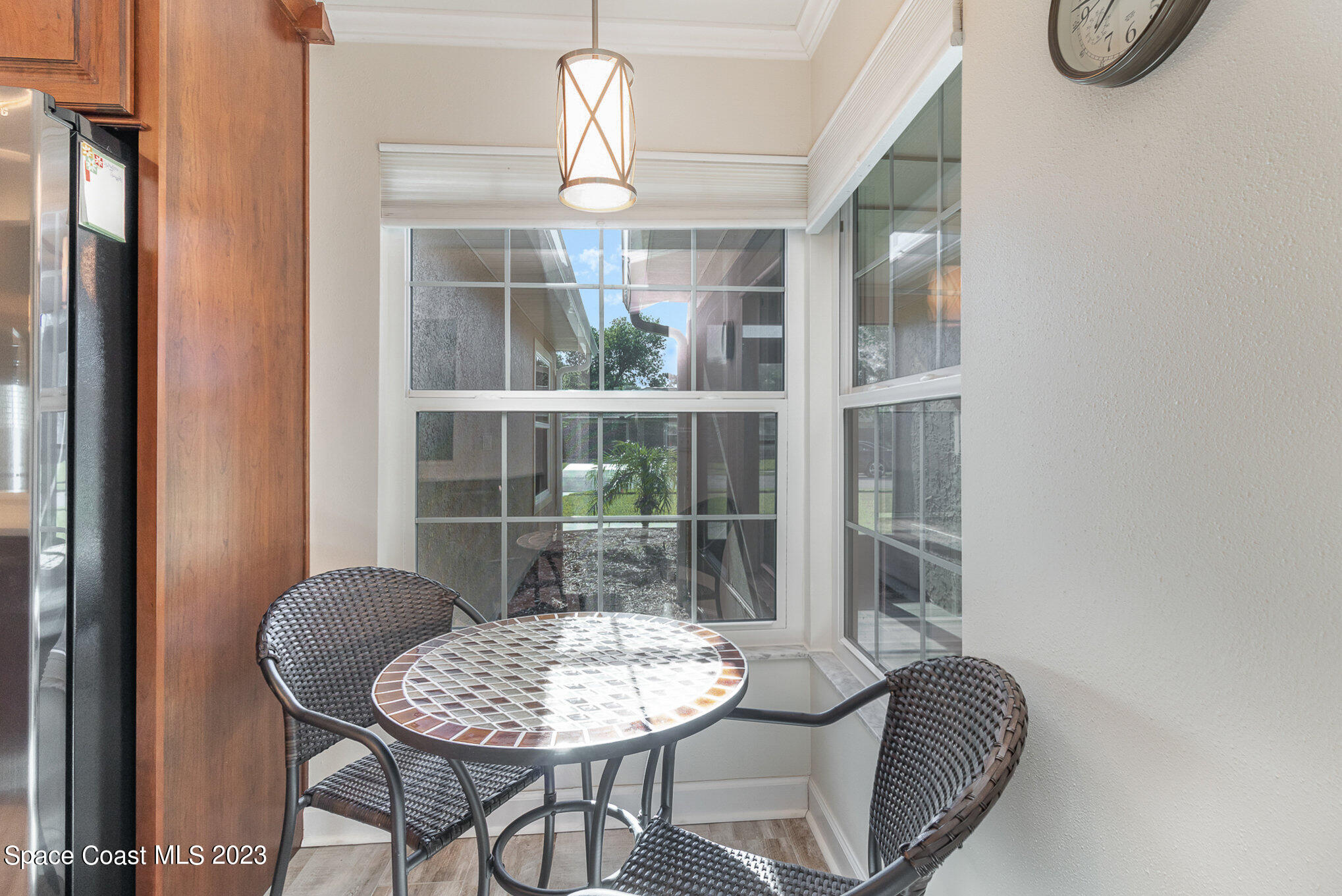 833 Pine Shadows Avenue Rockledge, FL 32955 - Photo 6 of 24 a dining room with furniture and window