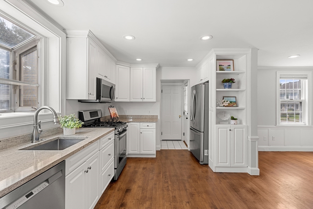 6 Shetland Road Marblehead, MA 01945 - Photo 10 of 39 a kitchen with granite countertop a refrigerator a sink a stove and cabinets