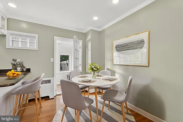 a dining room with furniture and window