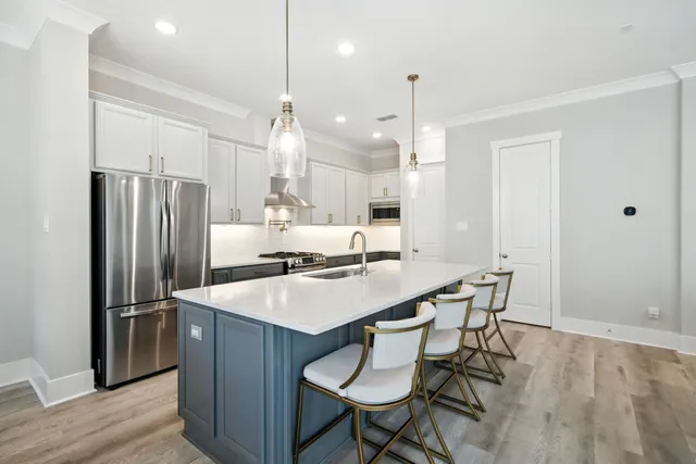 a kitchen with a sink stove and cabinets