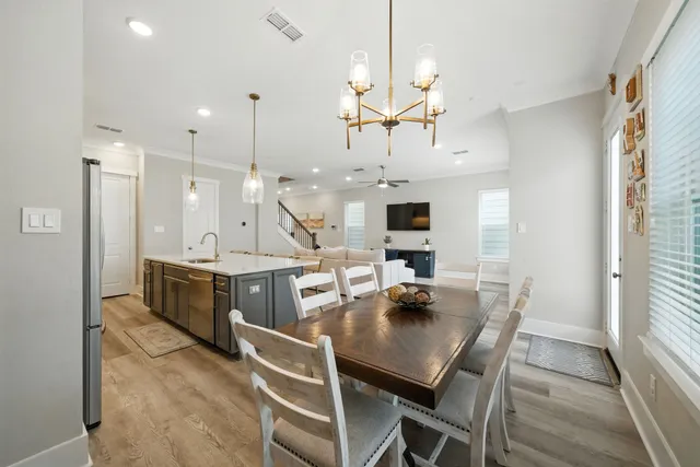a large kitchen with a table and chairs