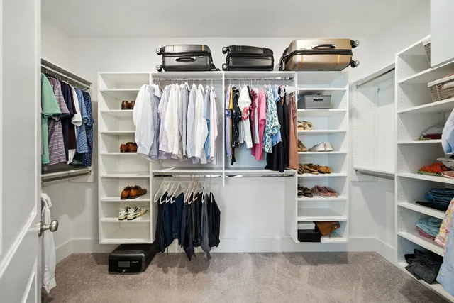 a spacious bathroom with a granite countertop sink mirror and shower