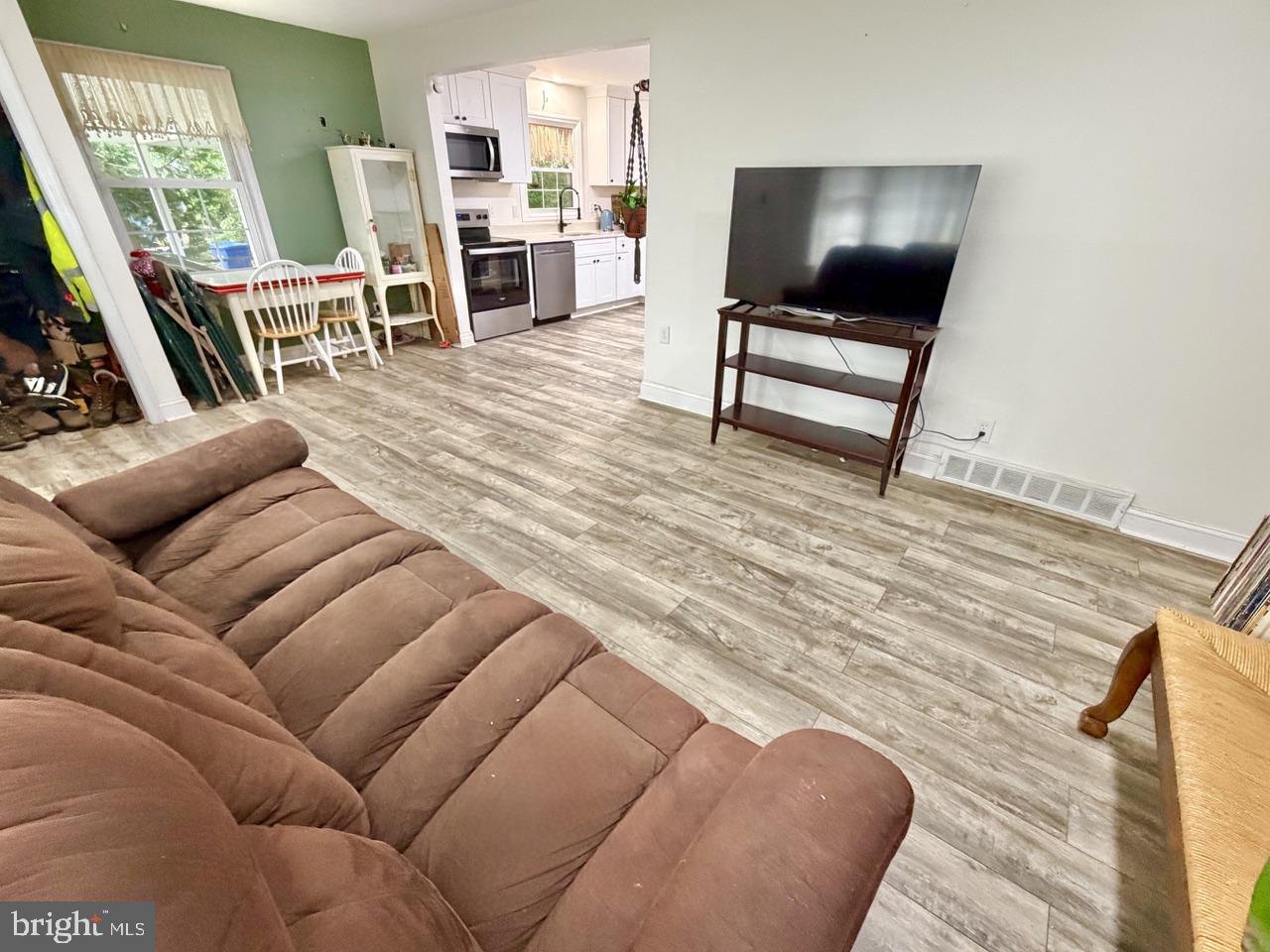 2413 Shelburn Road Millville, NJ 08332 - Photo 6 of 41 a living room with furniture and a flat screen tv