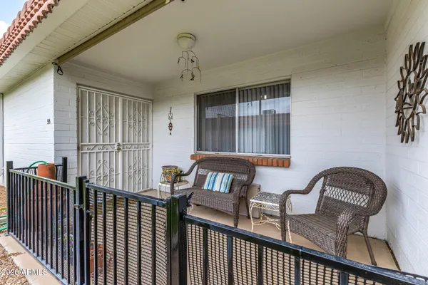 a view of a house with a yard and deck