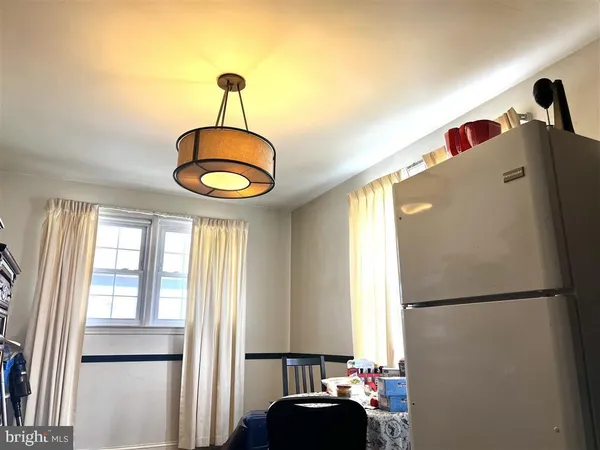 a kitchen with stainless steel appliances granite countertop a refrigerator and a window