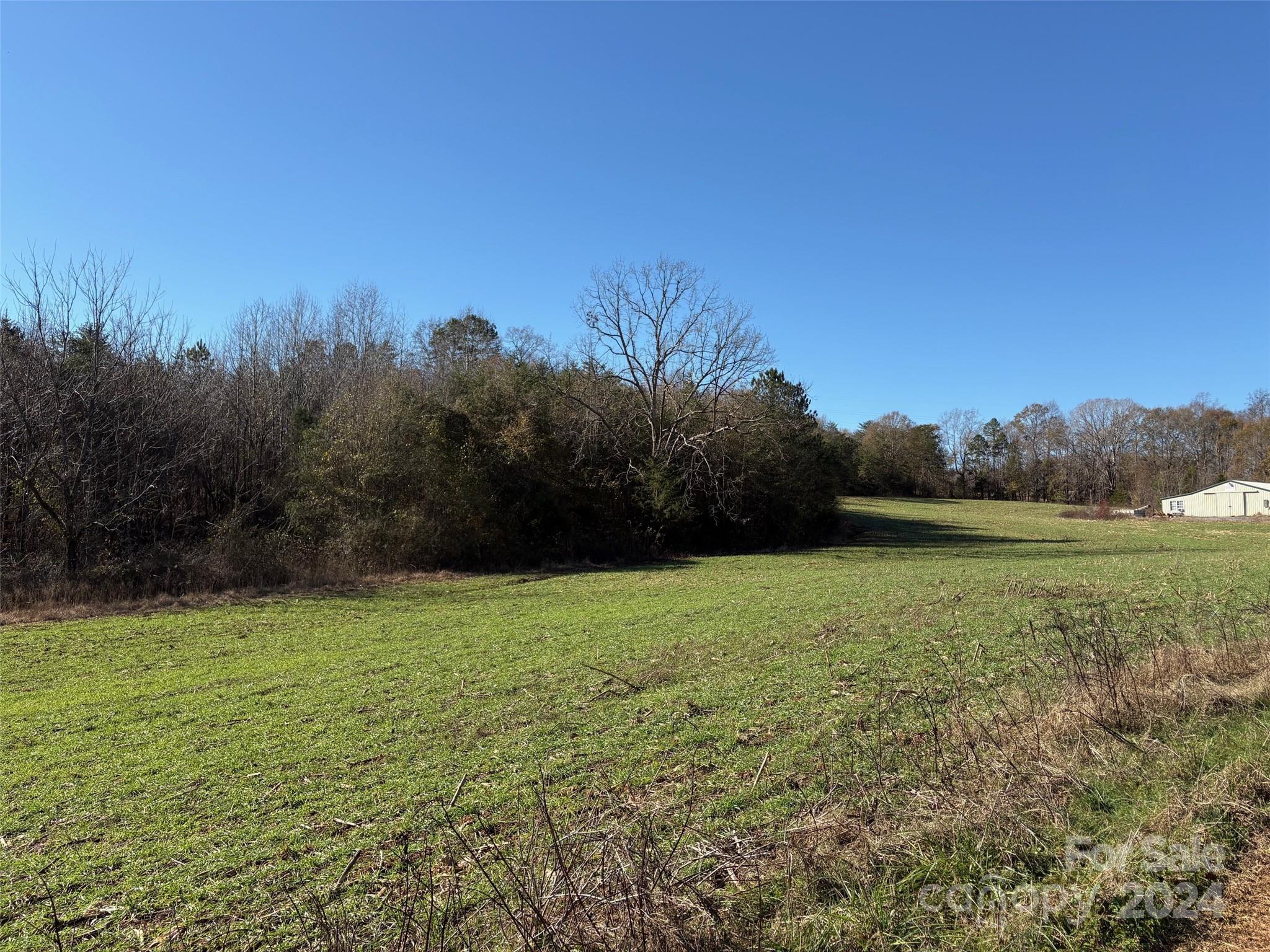 340 Beaver Dam Church Road Shelby, NC 28152 - Photo 4 of 8 a view of a field of grass and trees