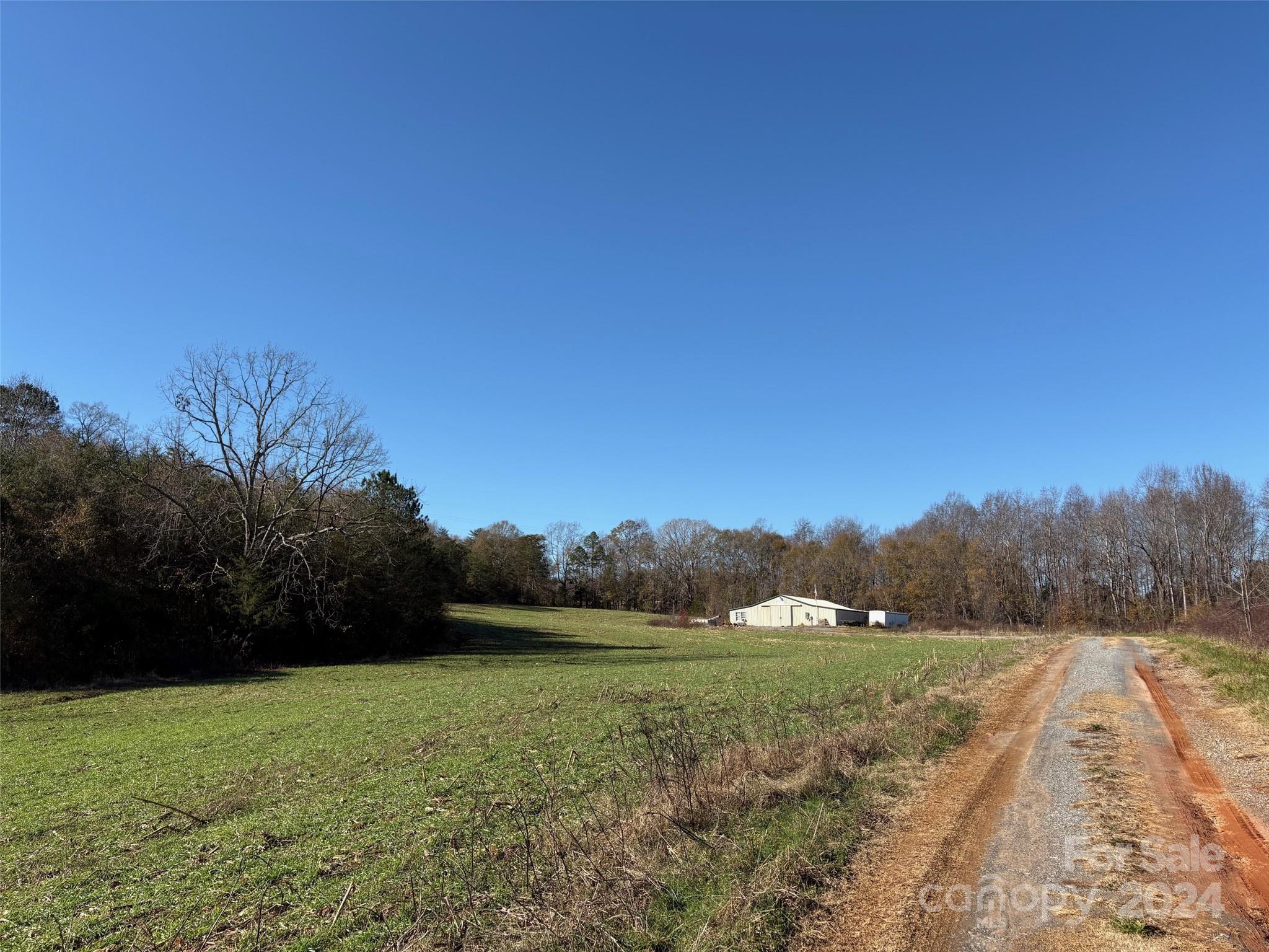 340 Beaver Dam Church Road Shelby, NC 28152 - Photo 8 of 8 a view of a green field with trees in the background