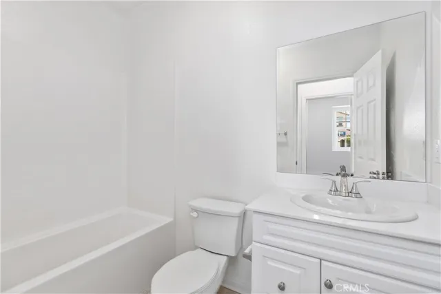 a bathroom with a sink toilet and a bathtub