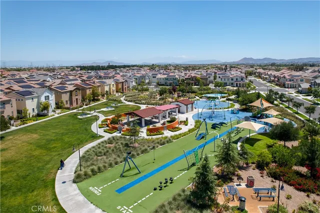 an aerial view of a chairs and table on a patio