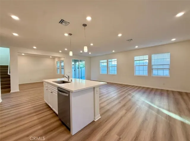 a kitchen with a stove and a sink