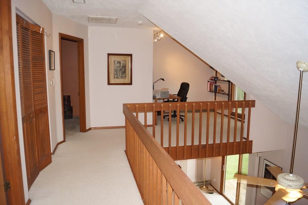 152 Reiber Road Renfrew, PA 16053 - Photo 11 of 25 The loft area and upstairs hallway overlooking the living room on the main floor.