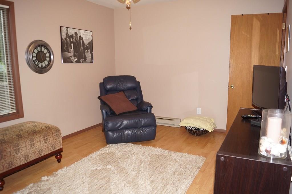 152 Reiber Road Renfrew, PA 16053 - Photo 8 of 25 Bedroom #3 located on the first floor of the home with a powder room attached. This room is currently being used as a sitting/tv room.