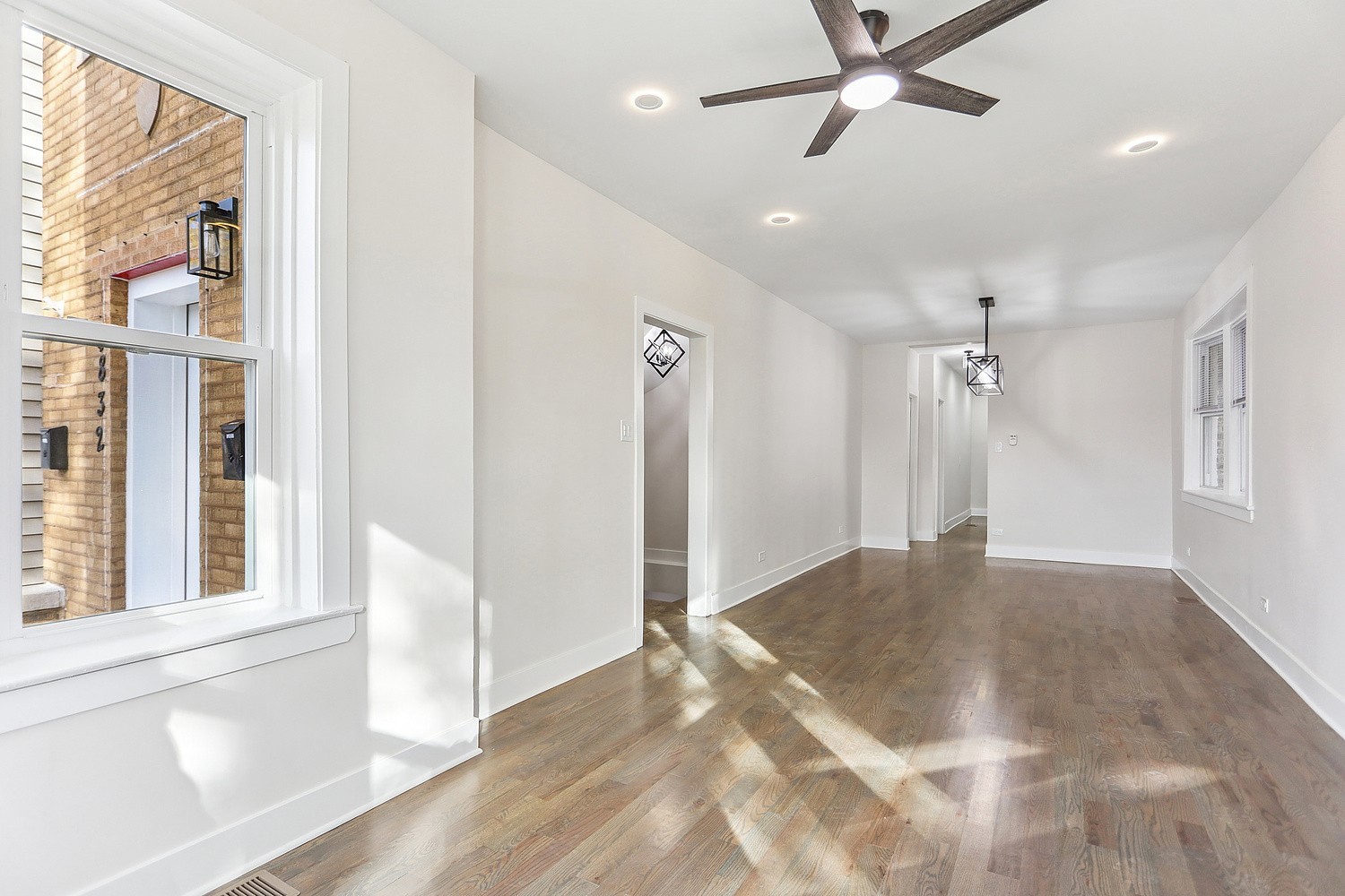 4832 West Harrison Street Chicago, IL 60644 - Photo 2 of 21 a view of a livingroom with a ceiling fan and window