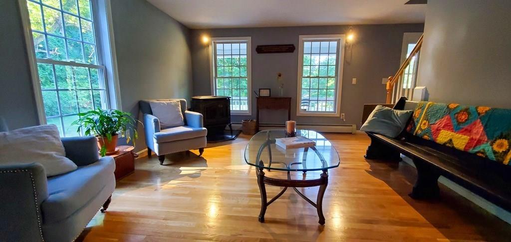 871 Northfield Road Lunenburg, MA 01462 - Photo 21 of 39 a living room with furniture and a potted plant