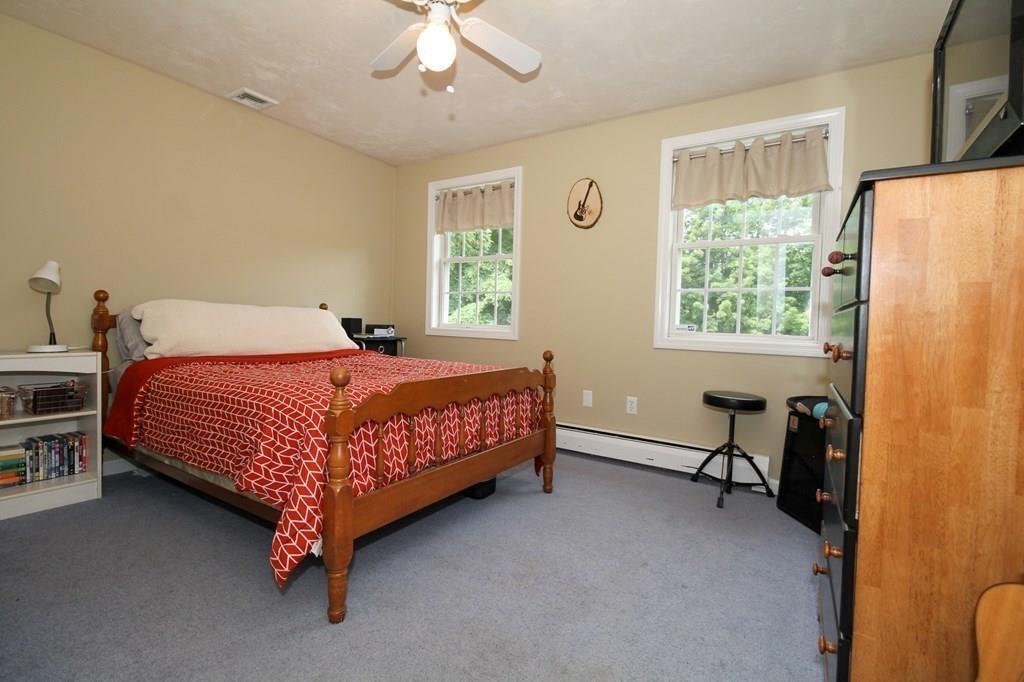 871 Northfield Road Lunenburg, MA 01462 - Photo 26 of 39 a bedroom with a bed chair and a window