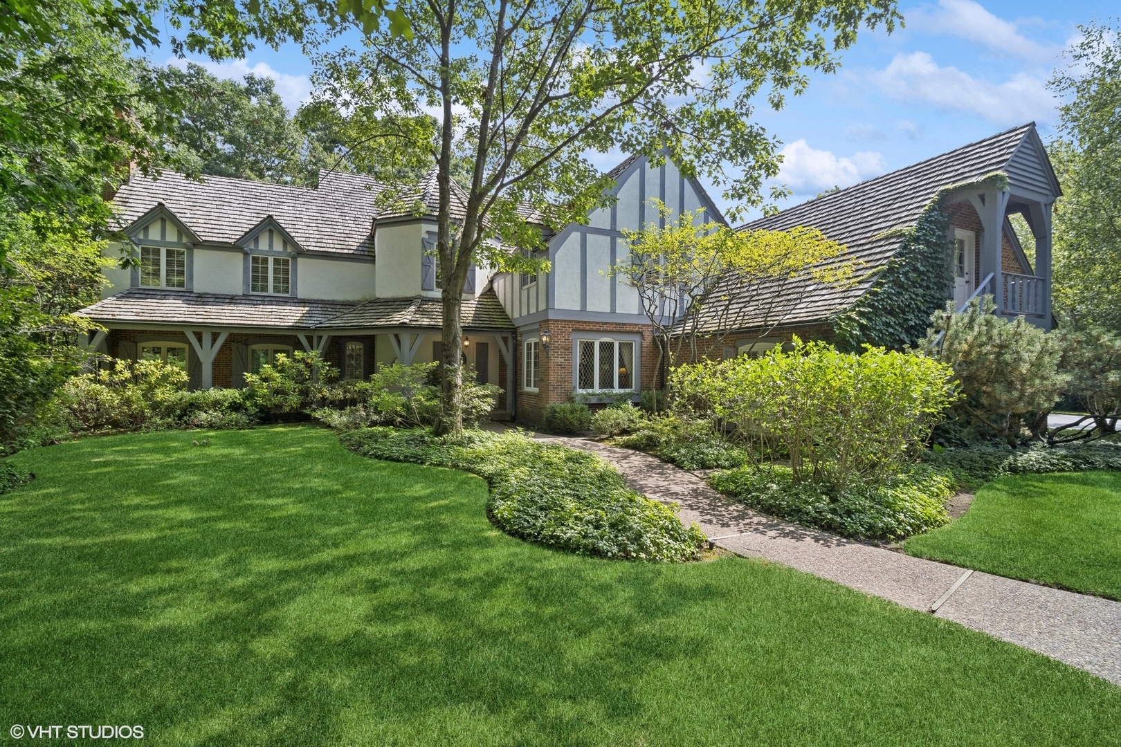 1214 Turicum Road Lake Forest, IL 60045 - Photo 1 of 37 a view of a house with a big yard plants and large trees