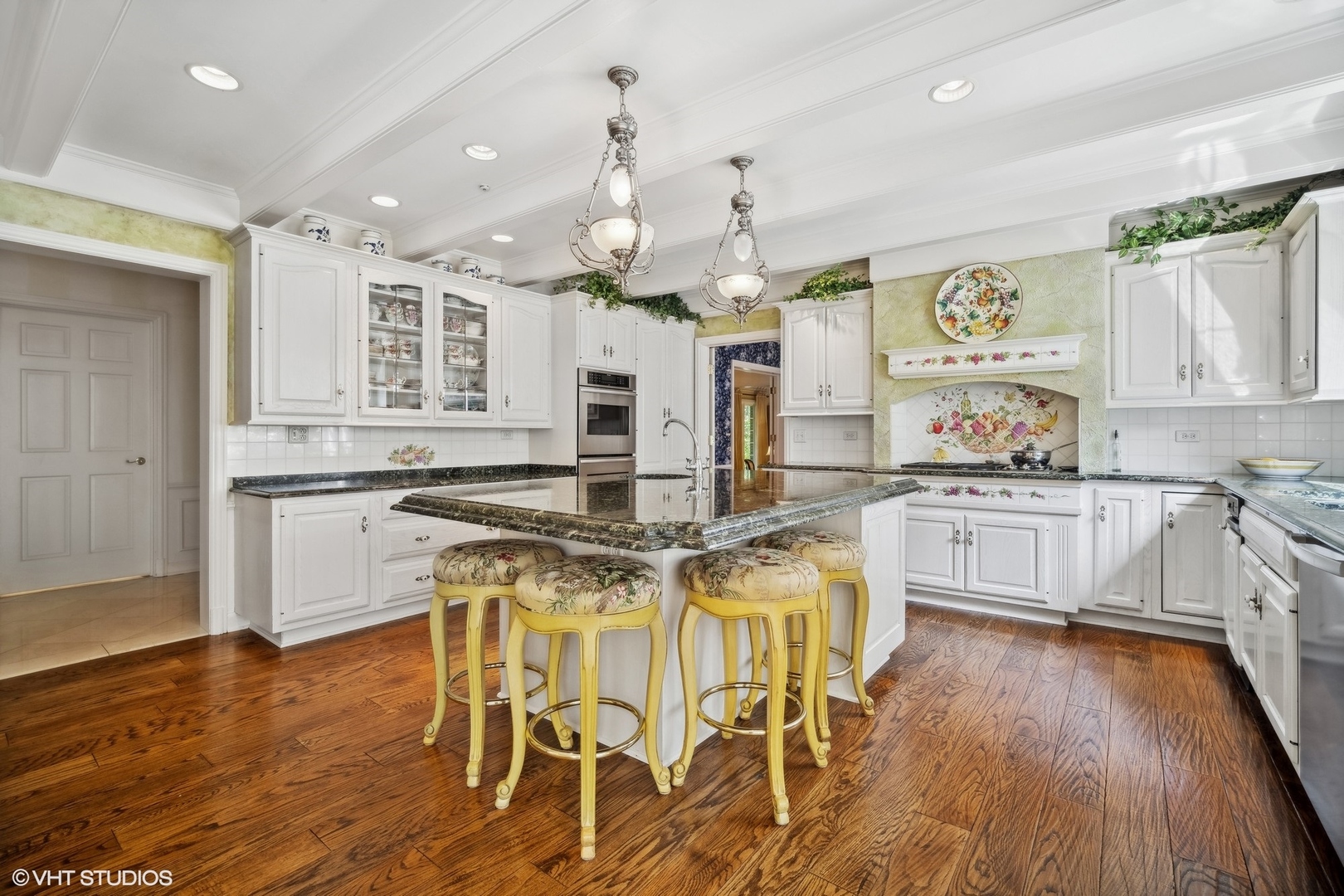 1214 Turicum Road Lake Forest, IL 60045 - Photo 11 of 37 a kitchen with stainless steel appliances kitchen island granite countertop a stove a sink dishwasher and white cabinets with wooden floor