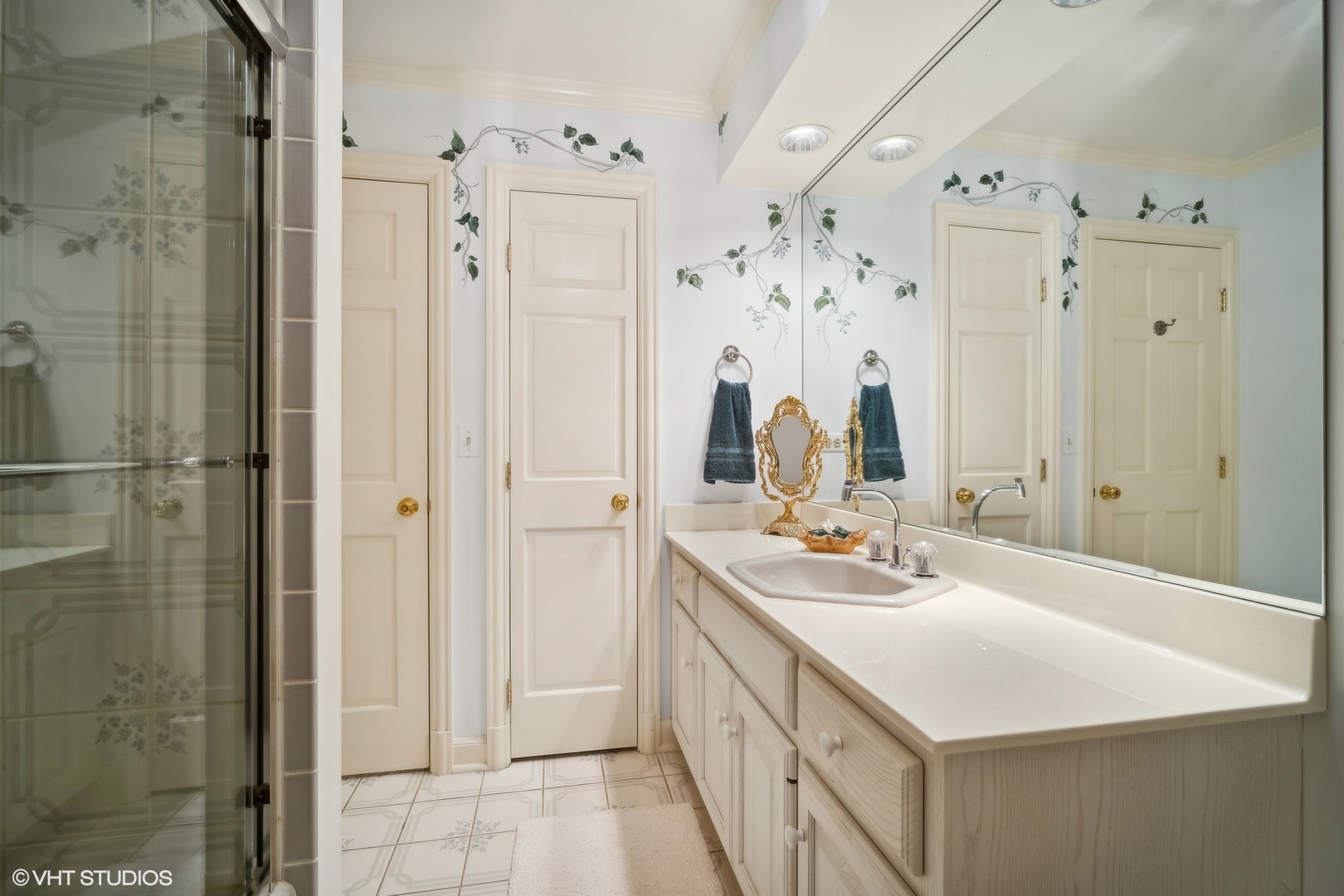1214 Turicum Road Lake Forest, IL 60045 - Photo 24 of 37 a bathroom with a double vanity sink mirror and shower