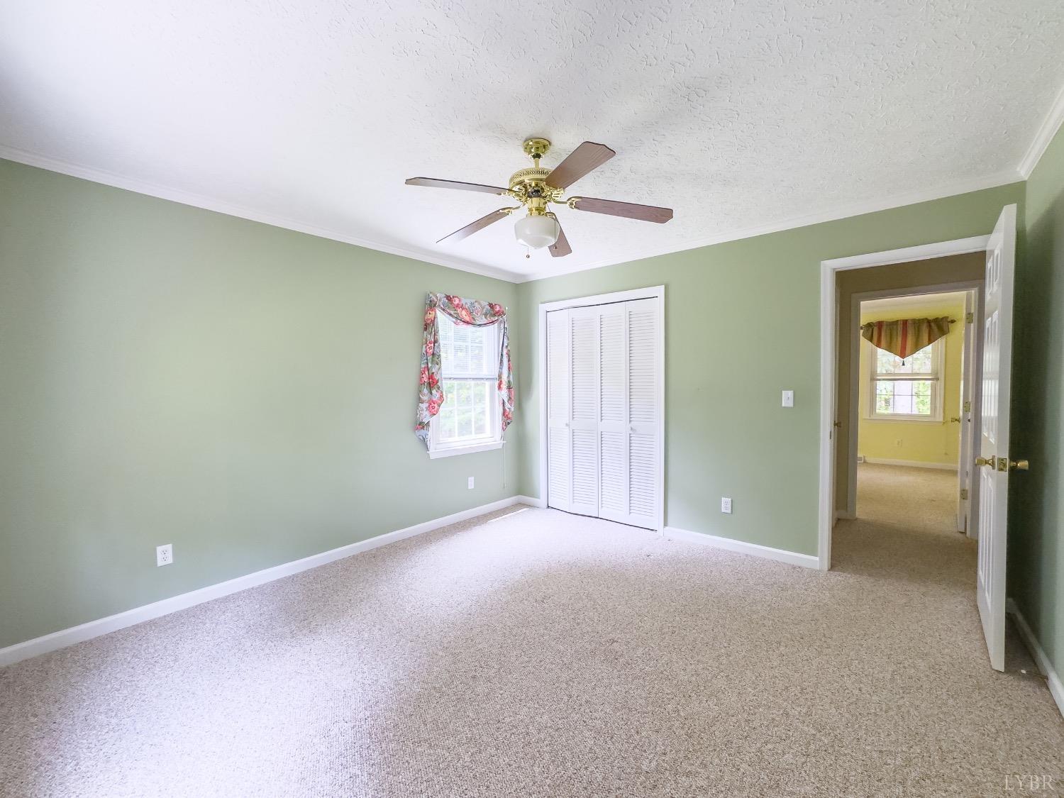 4681 Roark Mill Road Hurt, VA 24563 - Photo 23 of 76 a view of a room with a ceiling fan and a window