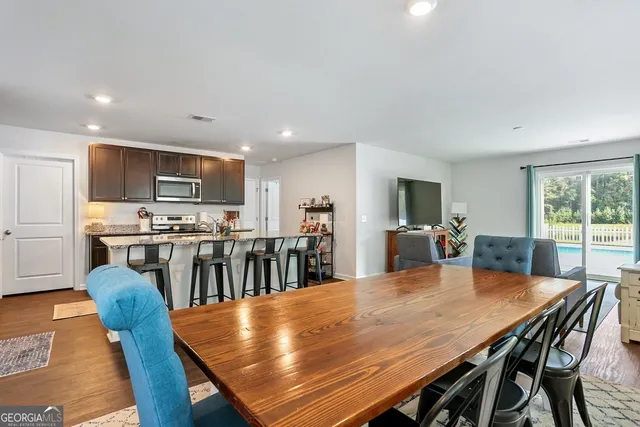 a livingroom with furniture and a flat screen tv