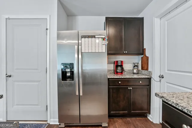 a bathroom with a sink toilet and a mirror