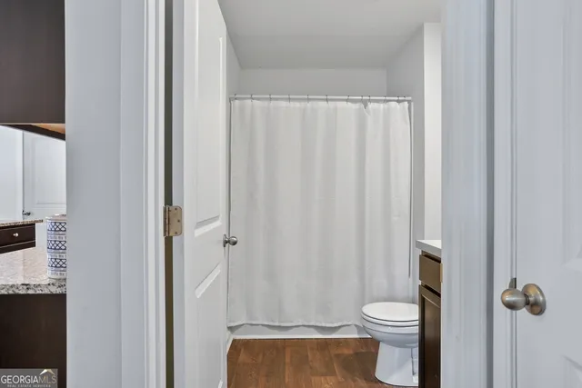 a bedroom with a bed and a television