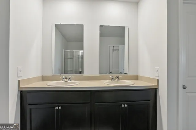 a bedroom with a bed and a dresser with the outer view