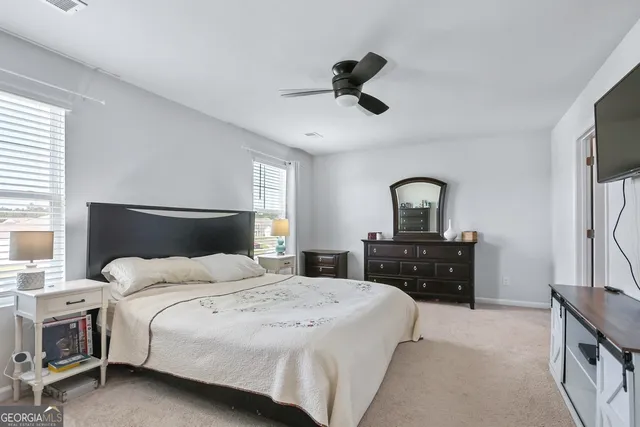a living room with furniture a piano and a window