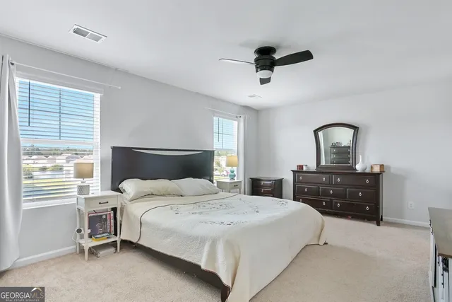 a view of storage and utility room with washer and dryer