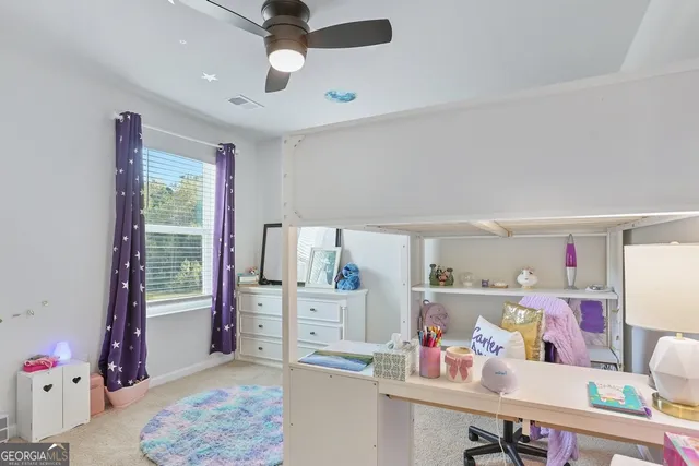 a view of a swimming pool with a patio and a yard