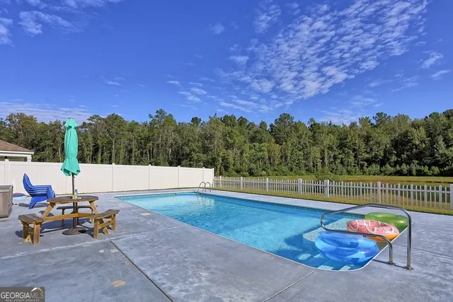 a view of a backyard with sitting area