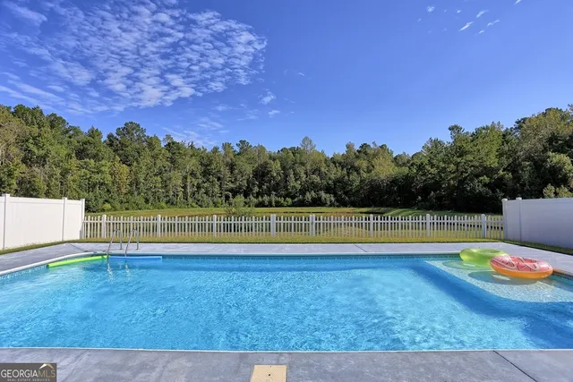 a view of a backyard with a patio