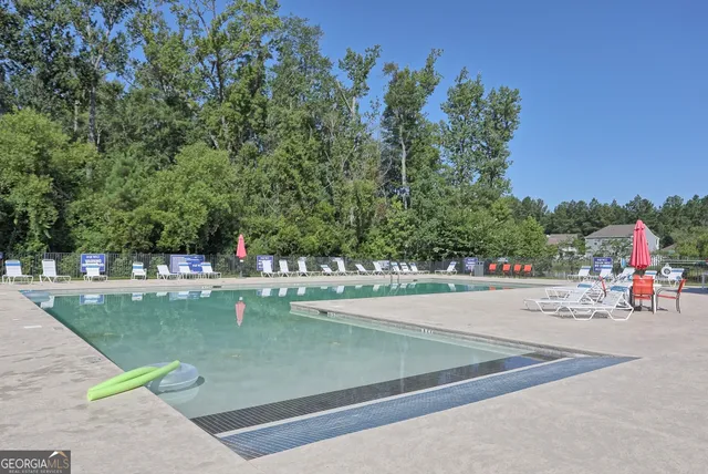 a view of a backyard with sitting area