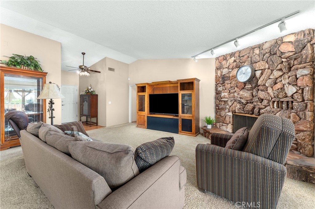 13346 Rimview Court Yucaipa, CA 92399 - Photo 17 of 60 a living room with furniture and a flat screen tv