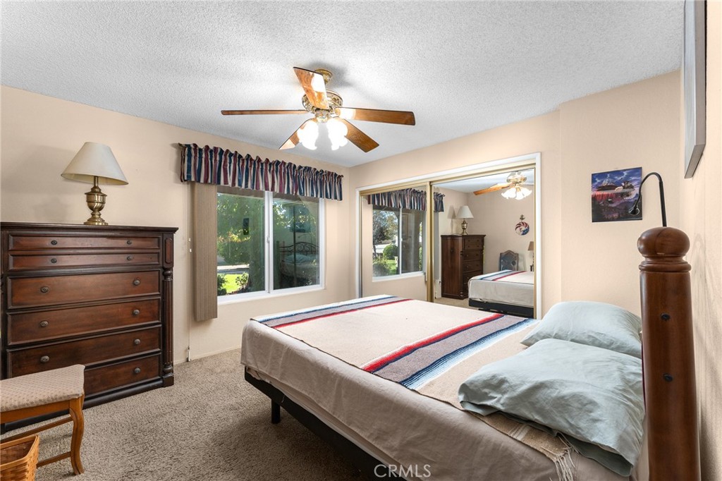 13346 Rimview Court Yucaipa, CA 92399 - Photo 30 of 60 a bedroom with a bed and wooden floor