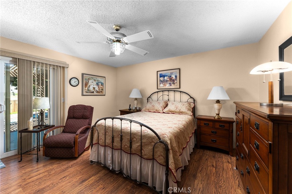 13346 Rimview Court Yucaipa, CA 92399 - Photo 32 of 60 a bedroom with a bed and wooden floor