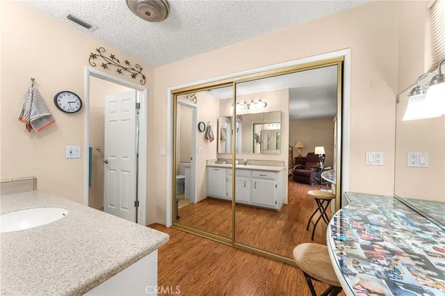 a view of a patio with table and chairs and wooden fence