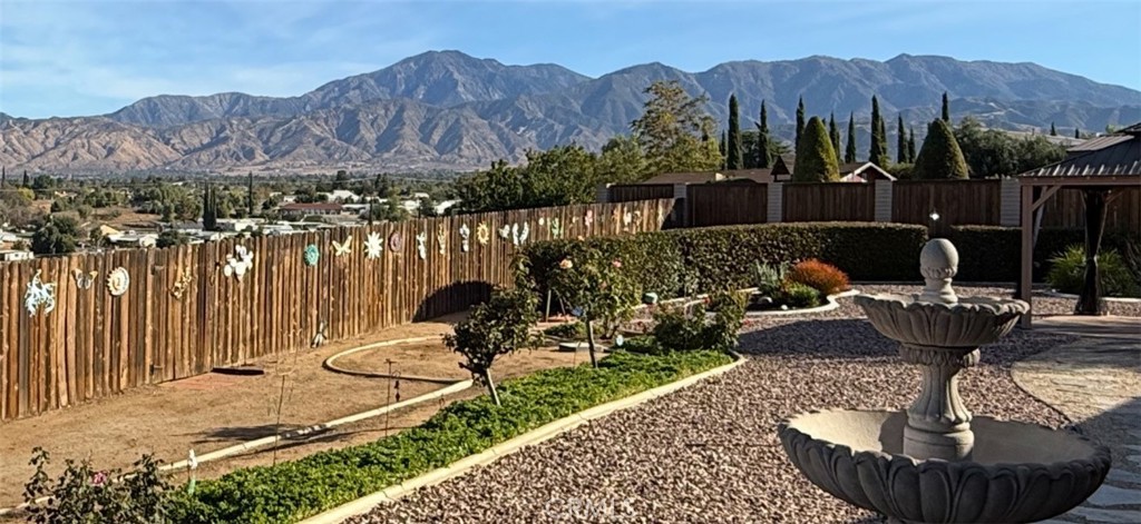 13346 Rimview Court Yucaipa, CA 92399 - Photo 8 of 60 a view of a chairs and table in backyard
