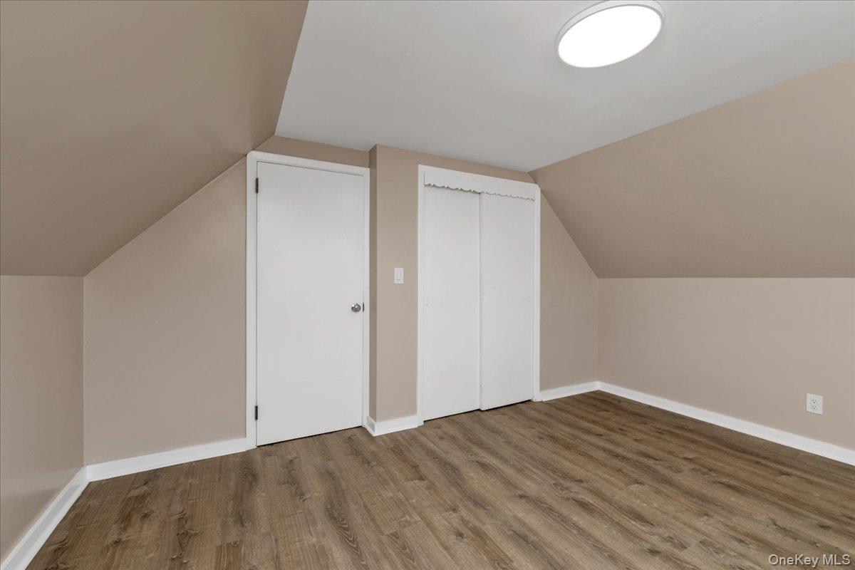 301 Merrifield Avenue Oceanside, NY 11572 - Photo 13 of 16 a view of empty room with wooden floor
