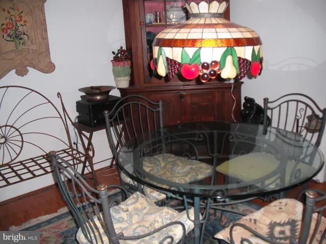 a kitchen with a sink and a mirror