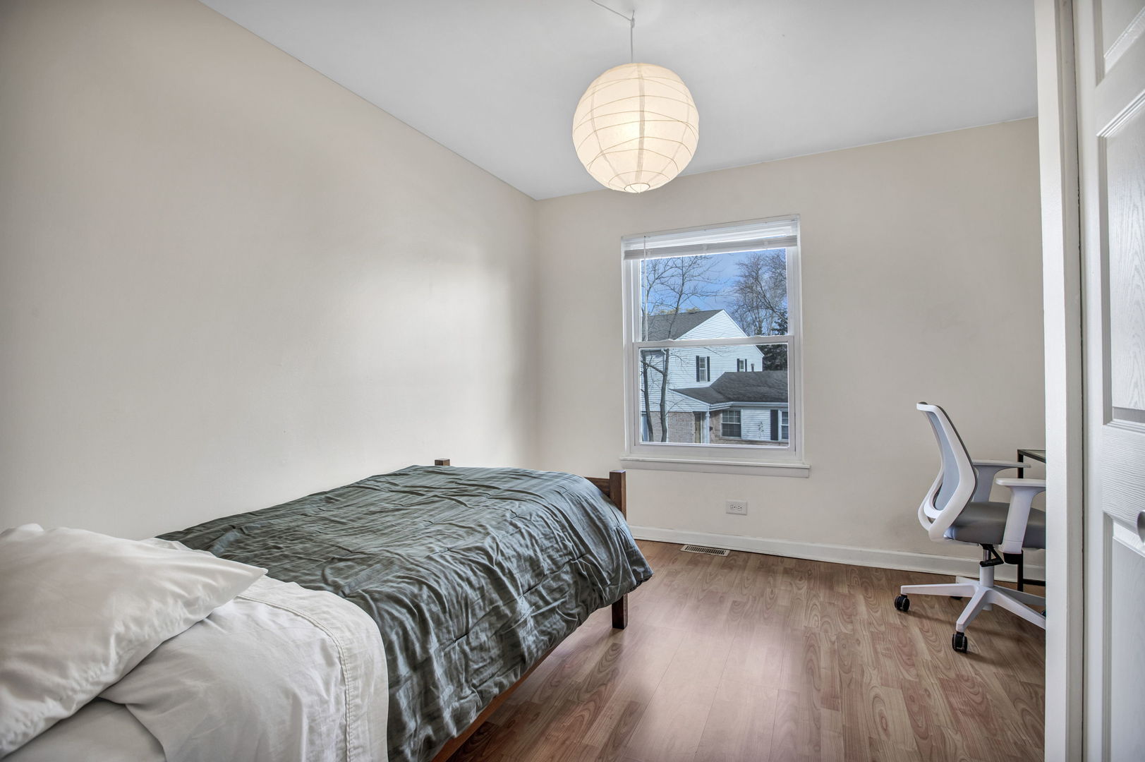 817 Pahl Road Elk Grove Village, IL 60007 - Photo 11 of 17 a bedroom with a bed and a window