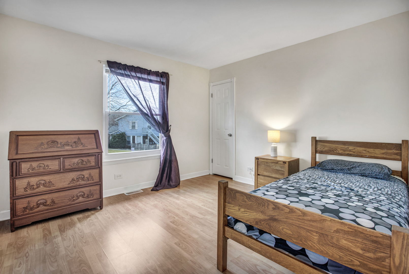817 Pahl Road Elk Grove Village, IL 60007 - Photo 12 of 17 a bedroom with a bed and a dresser