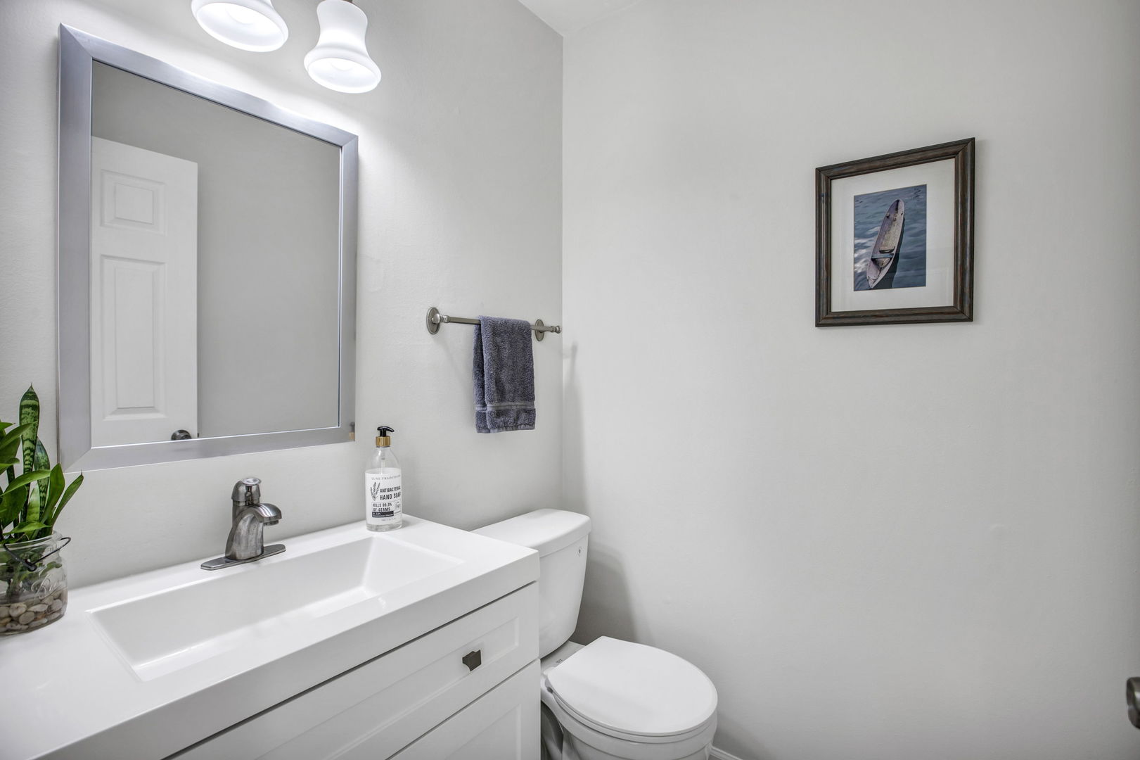817 Pahl Road Elk Grove Village, IL 60007 - Photo 13 of 17 a bathroom with a toilet a sink and mirror