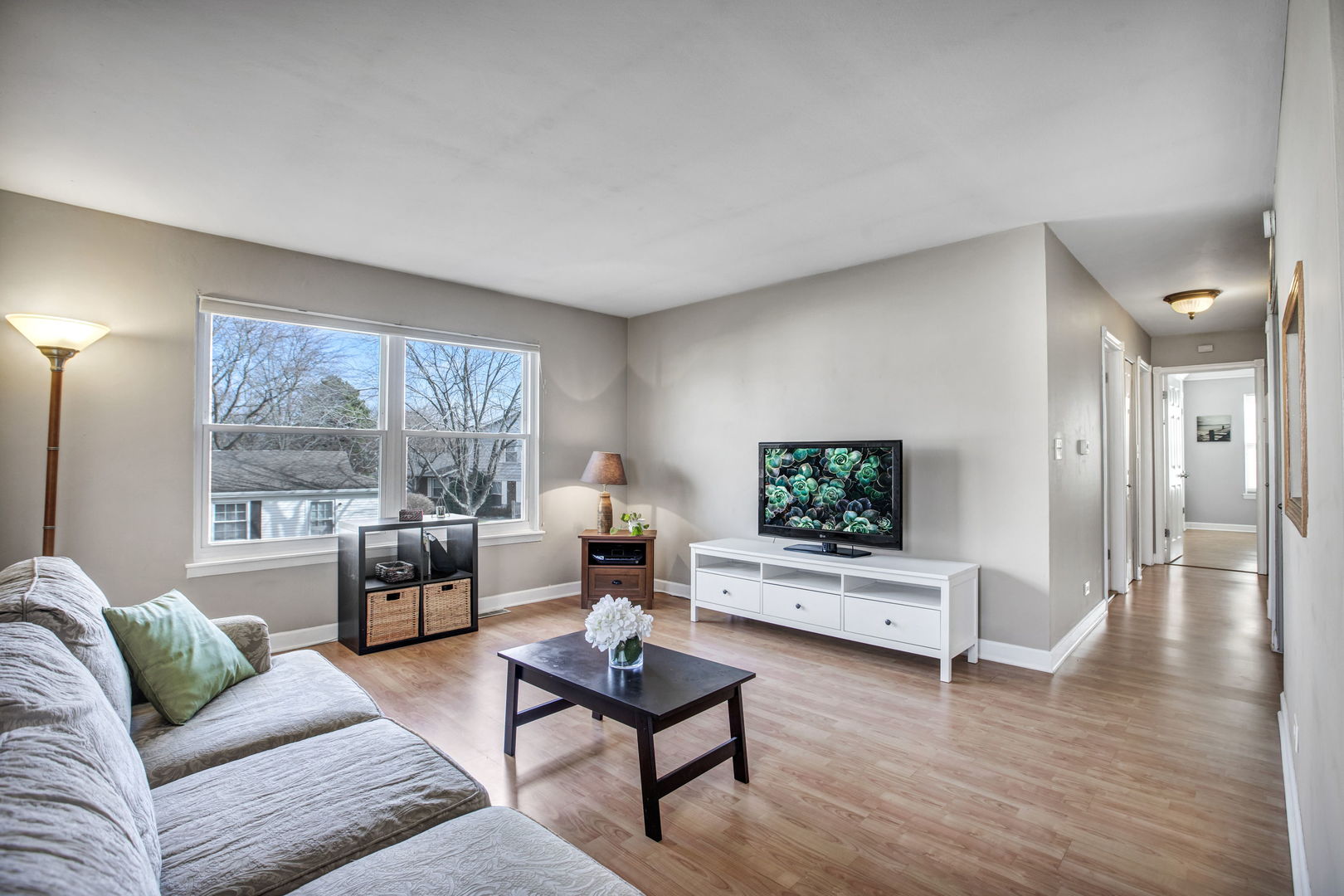 817 Pahl Road Elk Grove Village, IL 60007 - Photo 2 of 17 a living room with furniture and a flat screen tv