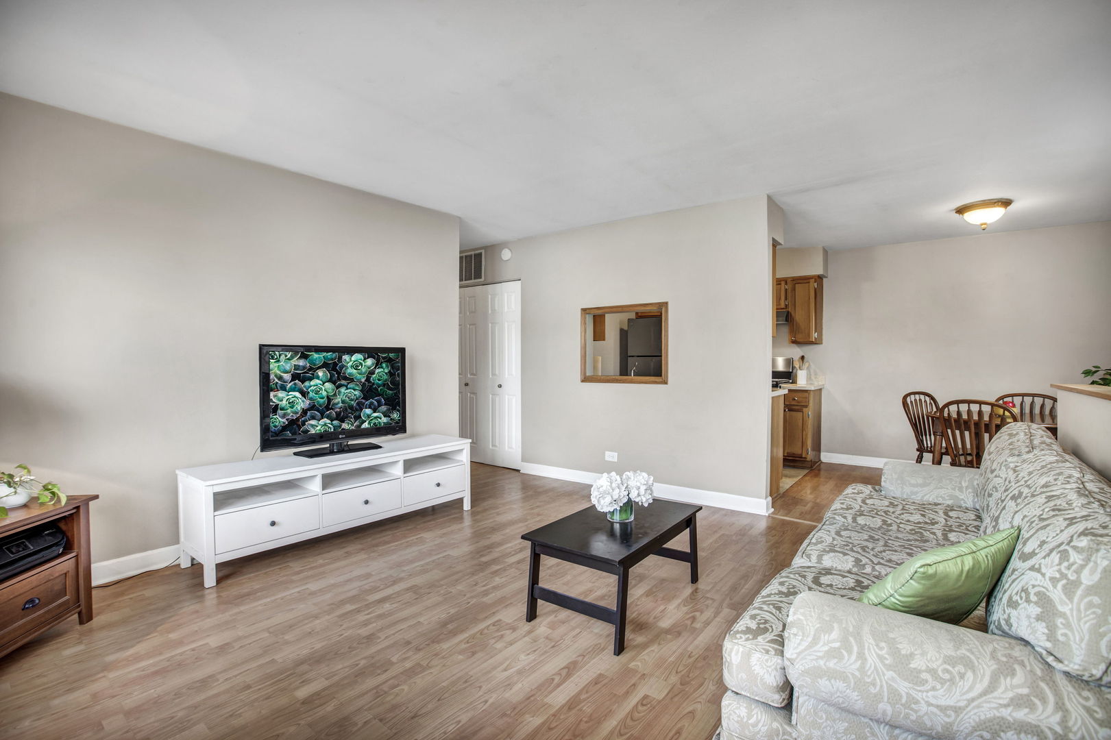 817 Pahl Road Elk Grove Village, IL 60007 - Photo 3 of 17 a living room with furniture and a flat screen tv